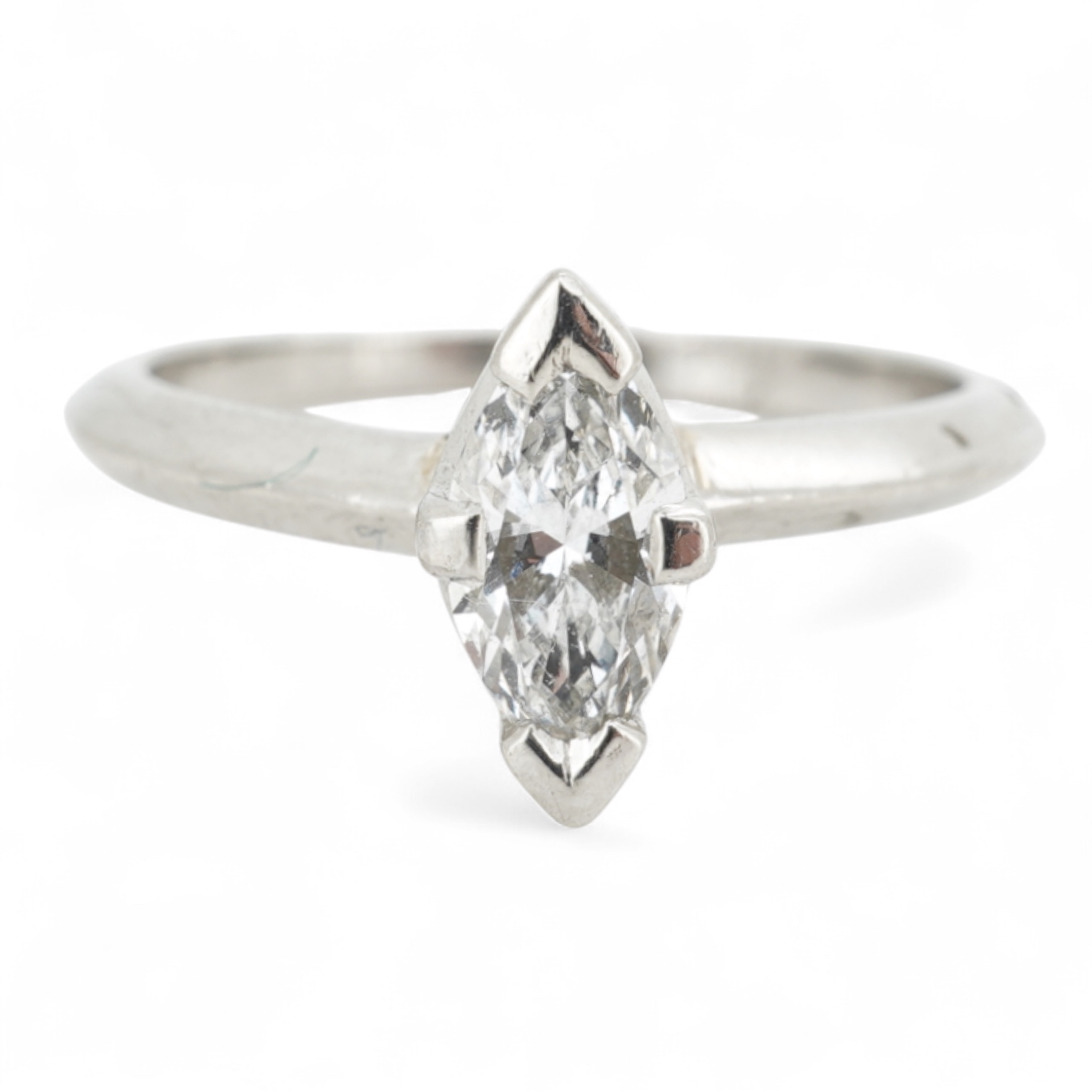 A diamond ring, claw-set with a marquise-shaped diamond weighing approximately 0.50 carats, mounted in platinum, size L, British hallmarks, gross weight approximately 4 grams